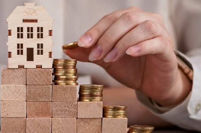 Coins,On,The,Steps,With,A,House,At,The,Top,
