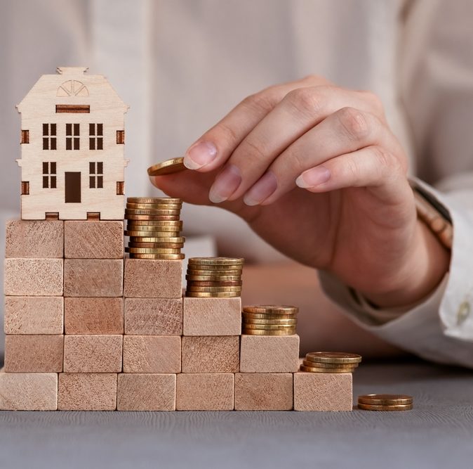 Coins,On,The,Steps,With,A,House,At,The,Top,